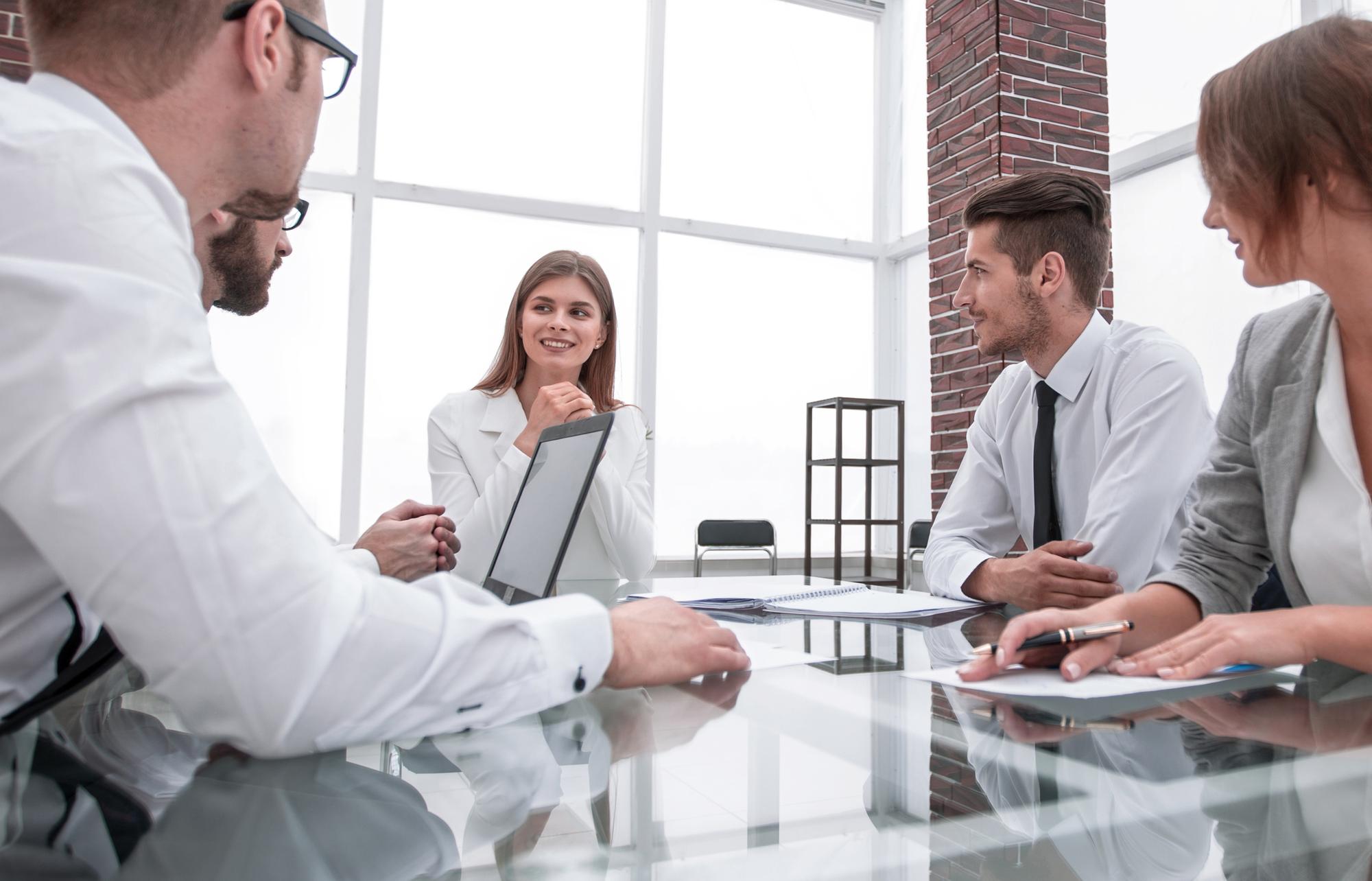 Process improvement specialists conducting operational audit for manufacturing client